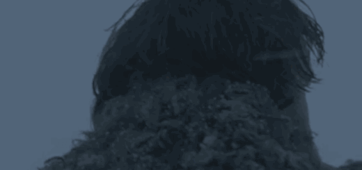 snow covered frigtened man slowly turning around to see whats behind him